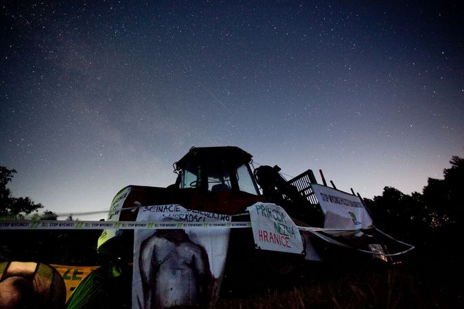 Starry sky above the harvester occupied by protesters